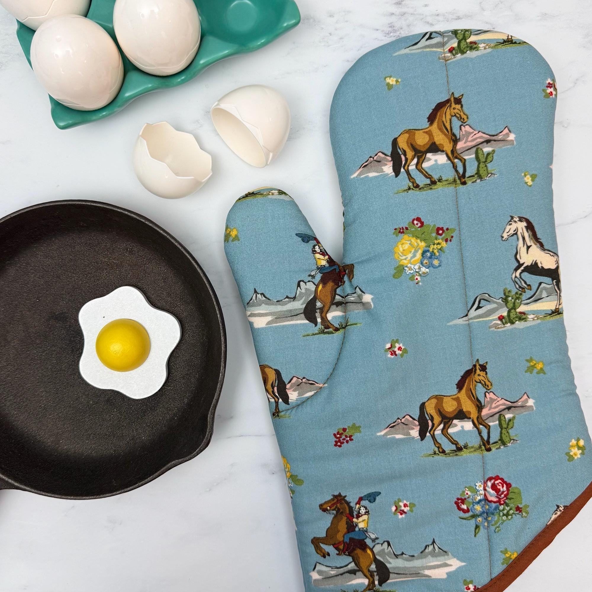 Cowgirl Rides On Oven Mitt